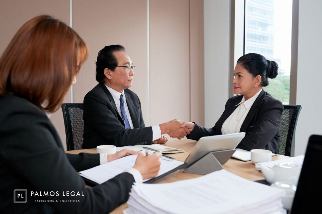 Civil lawyers reviewing contract and shareholder agreement to resolve business disputes